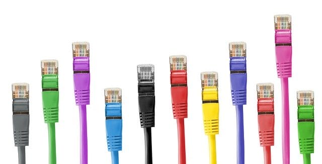 eleven brightly coloured ethernet cables