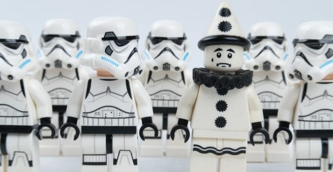 lego stormtroopers looking at lego clown as proxy for key differences between a blog and a vlog