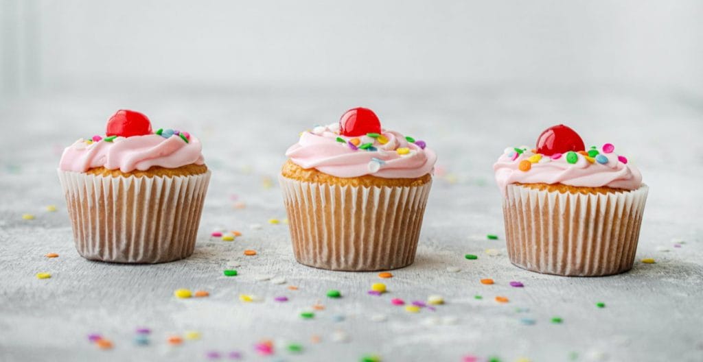 3 cup cakes with cherries on top as proxy for top amazon sellers out deliver their competitors