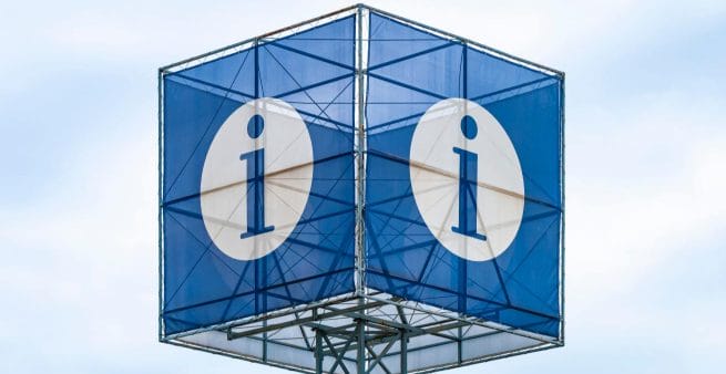 massive cube sign with information i logo in white on blue