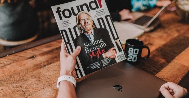 richard branson on cover of book being held as proxy for starting your own business