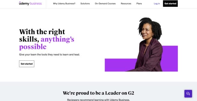 udemy landing page example with person facing camera on white background with black and purple text